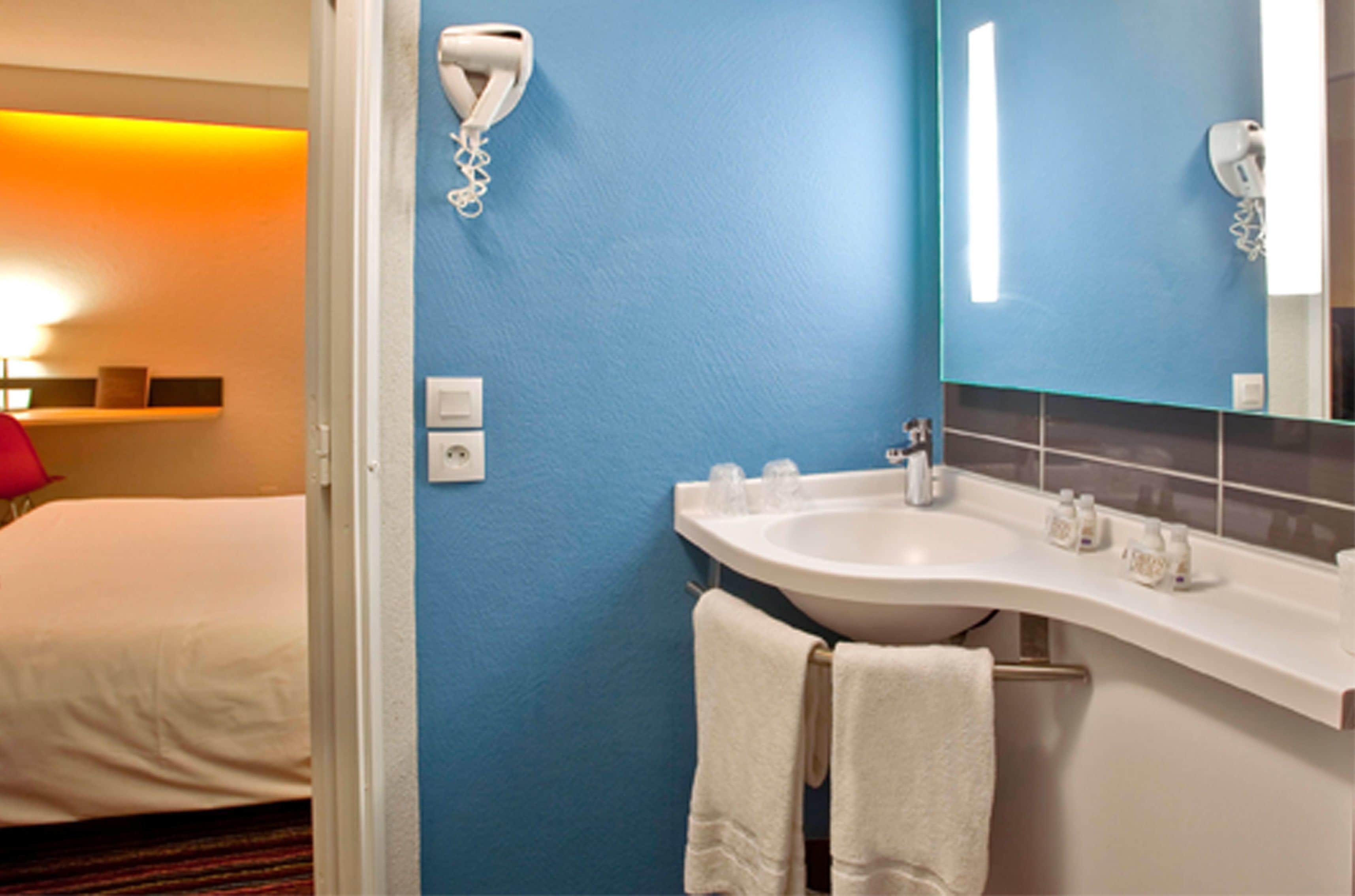 shower, eco-friendly toiletries, hair dryer, towels