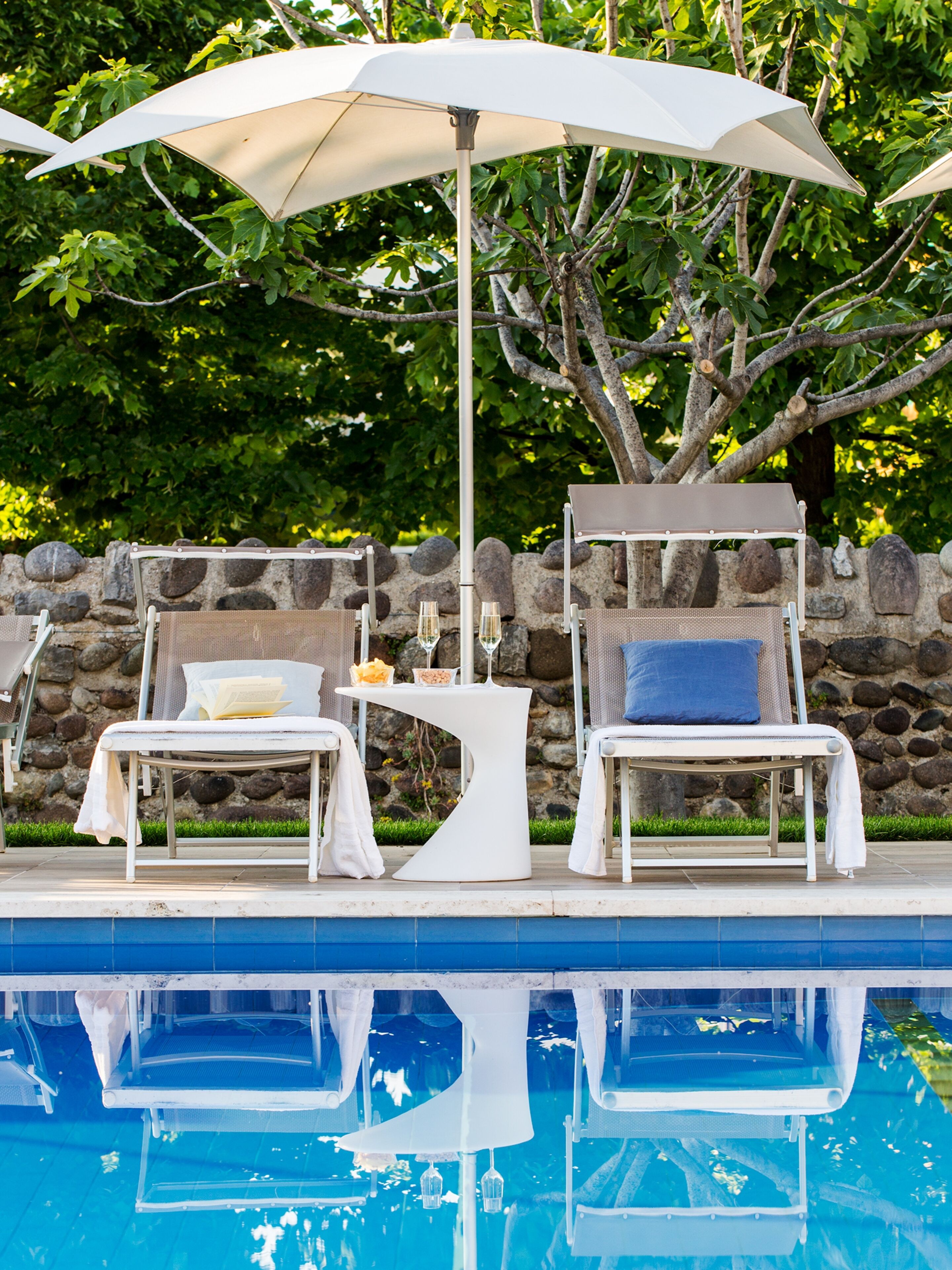 outdoor pool, pool umbrellas, pool loungers