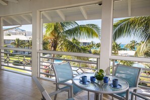 Junior Suite, Partial Ocean View | 1 bedroom, in-room safe, iron/ironing board, free WiFi