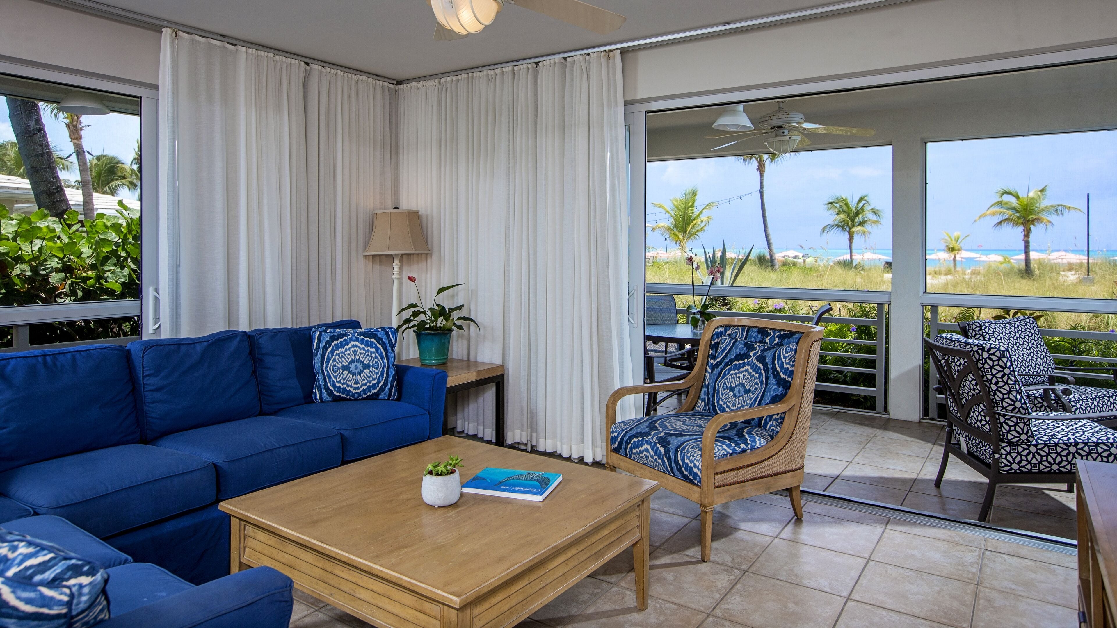 deluxe suite, 2 bedrooms, beachfront | living area | tv