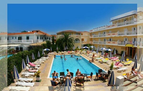 Outdoor pool, open 9 AM to 9:00 PM, pool umbrellas, pool loungers