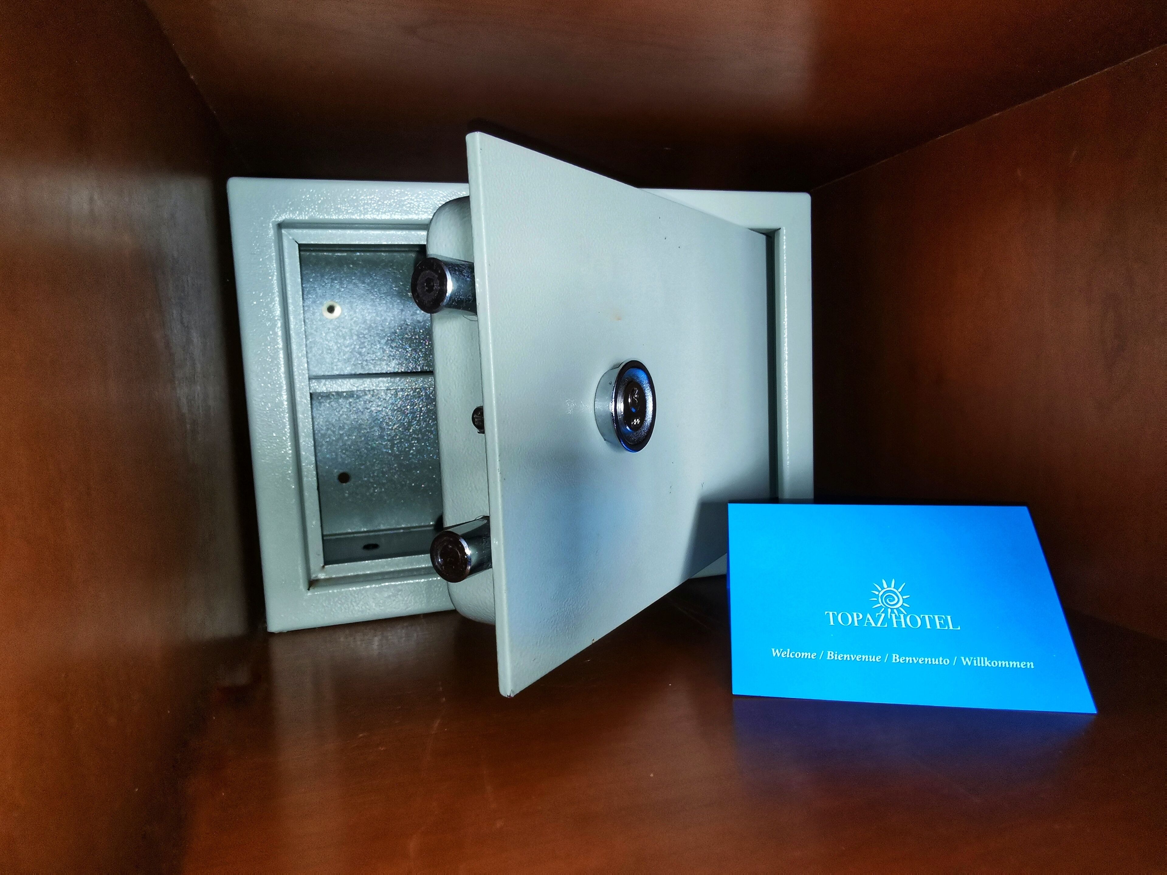 A safe with a blue card beside it.