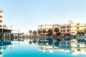 Indoor pool, outdoor pool, open 8:00 AM to 6:00 PM, pool umbrellas