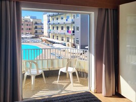 Twin Room, Pool View | In-room safe, desk, blackout drapes, iron/ironing board