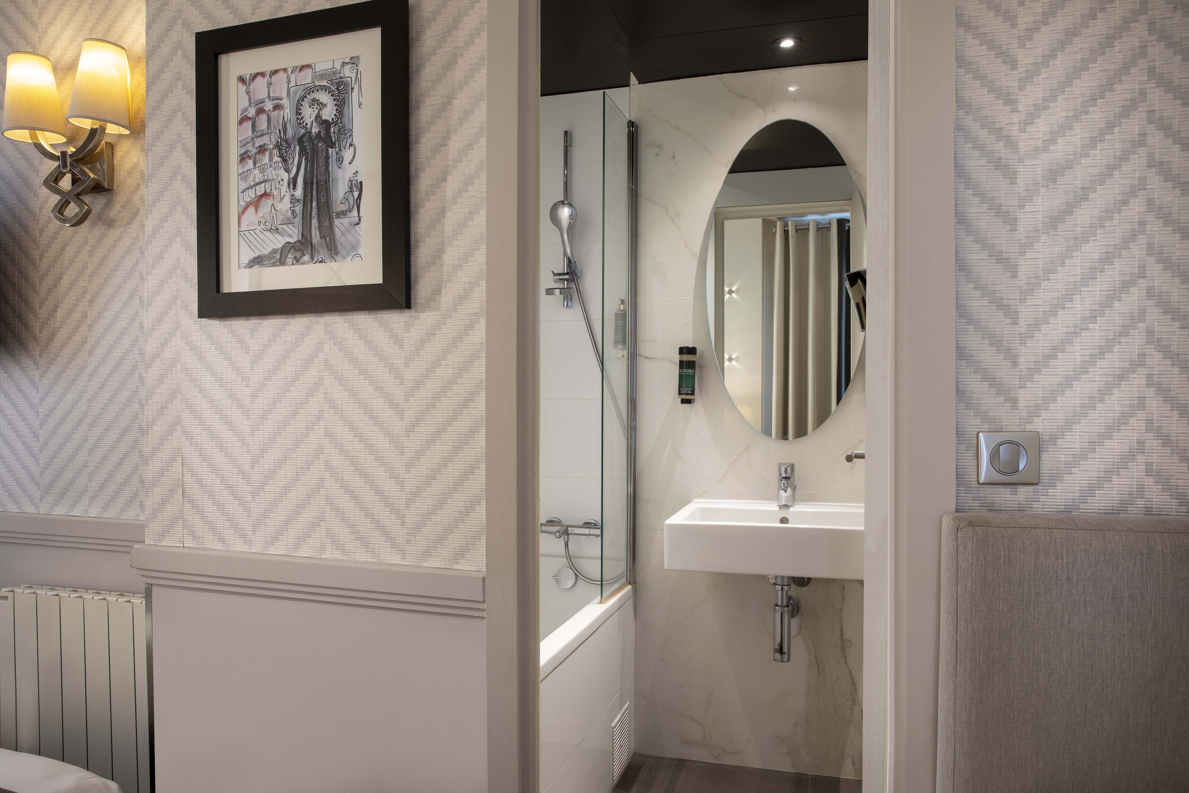 deluxe triple room | bathroom | hair dryer, towels