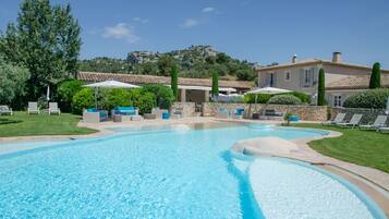 Outdoor pool, pool umbrellas, pool loungers
