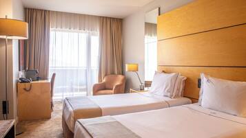 Double or Twin Room | Free minibar items, in-room safe, desk, blackout curtains
