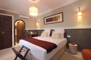 Deluxe Room | Pillow-top beds, in-room safe, individually decorated, desk