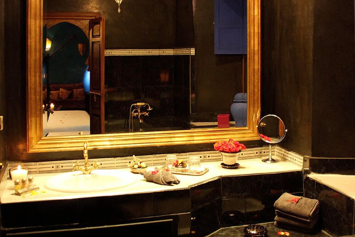 Designer toiletries, hair dryer, bathrobes, towels