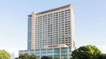 A tall, modern building with a sign reading "PARADOX KUNSHAN".