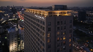 A high-rise building with the name "PARADOX" prominently displayed on its facade. - Paradox Kunshan (Suzhou)
