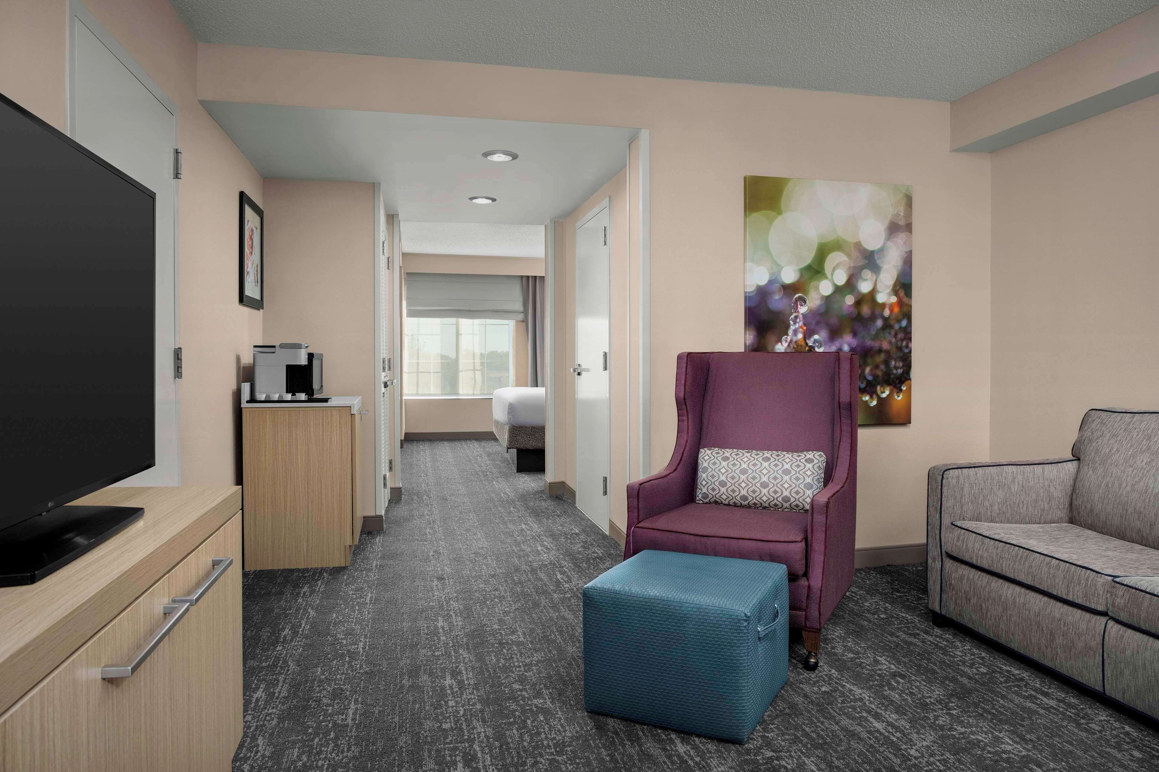 studio suite, 1 king bed with sofa bed | living area | 32-inch lcd tv with cable channels, tv, mp3 dock