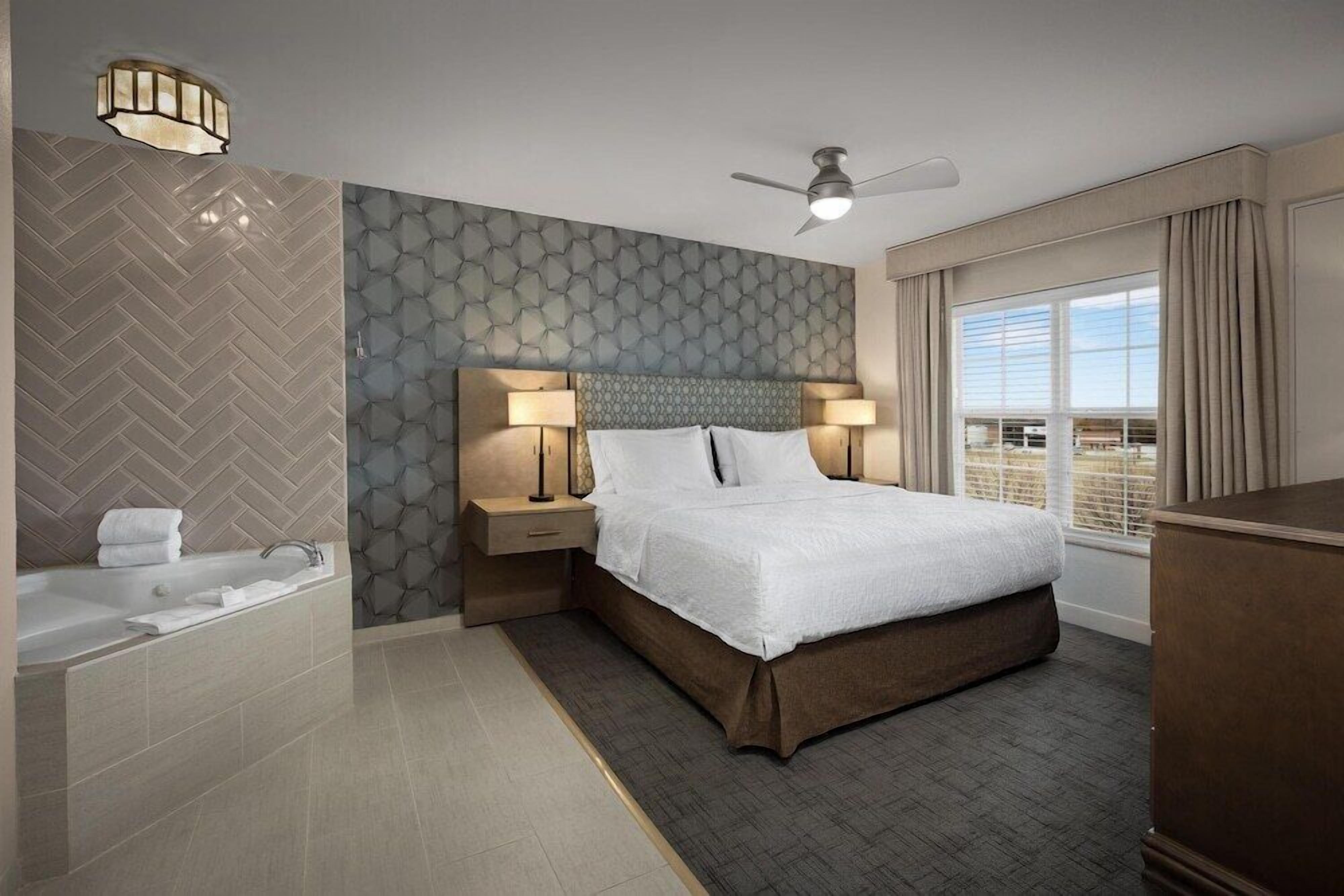 Premium bedding, down comforters, pillowtop beds, in-room safe