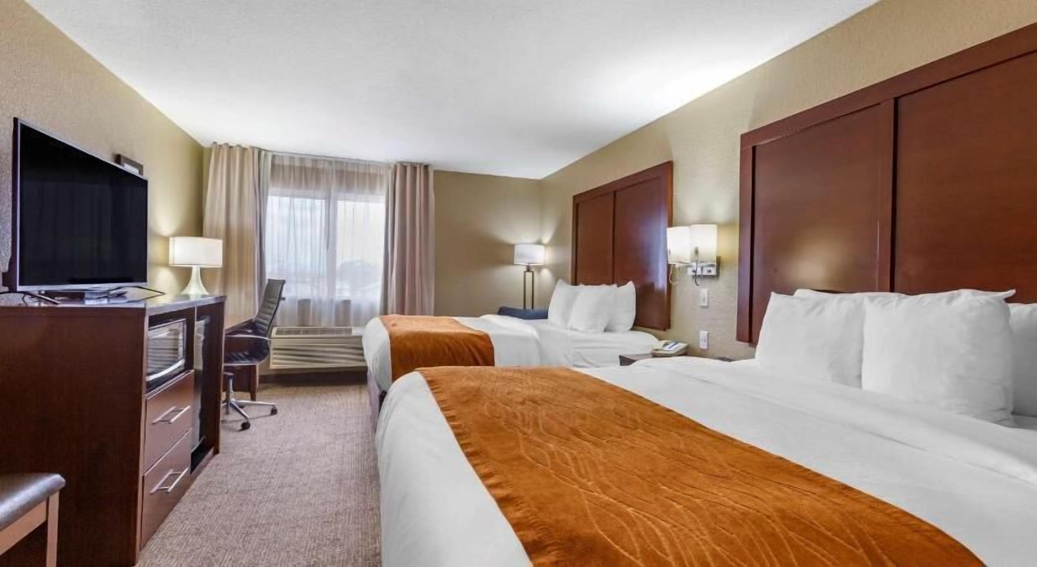 Desk, blackout drapes, iron/ironing board, rollaway beds