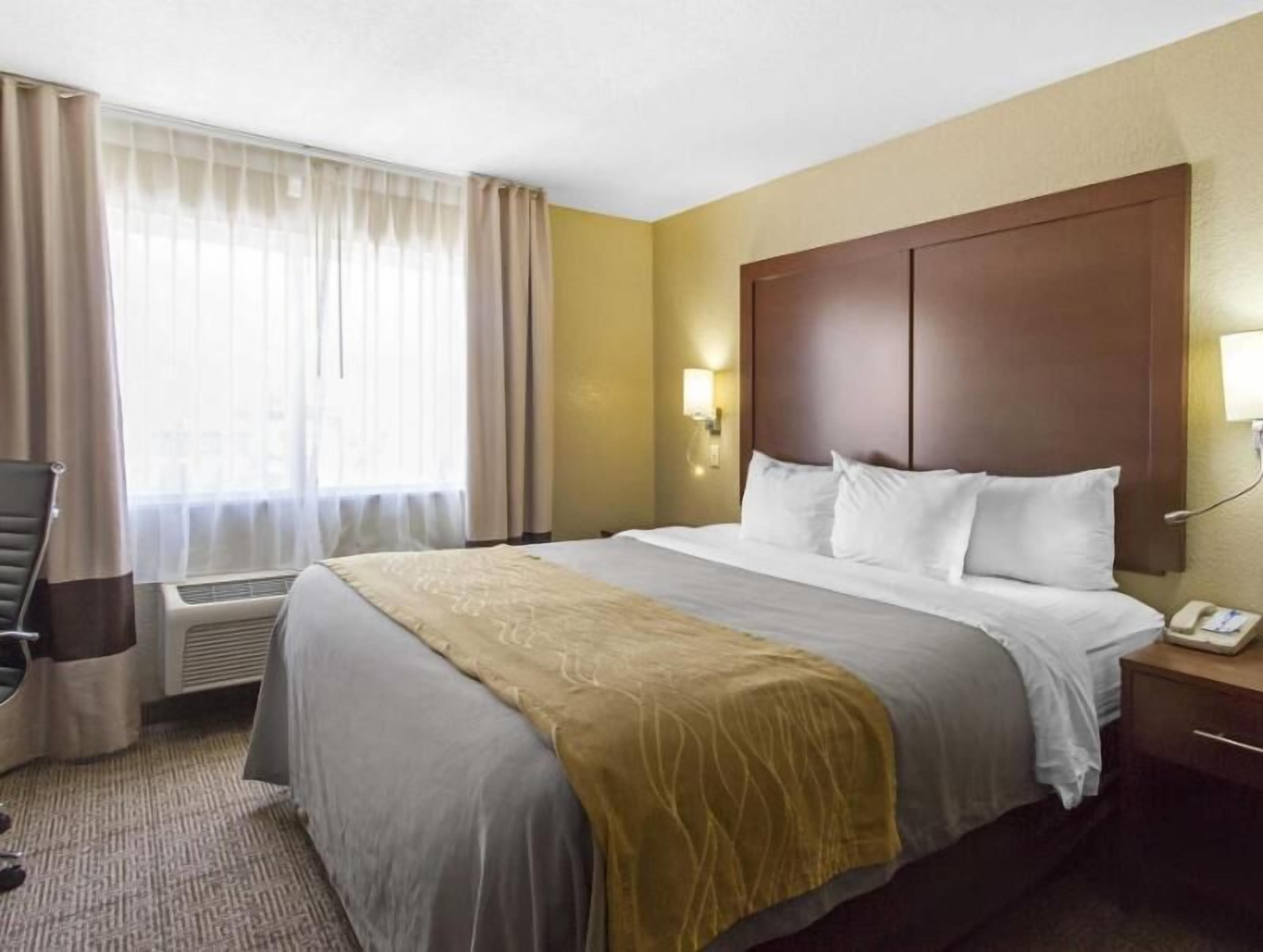 Desk, blackout drapes, iron/ironing board, rollaway beds