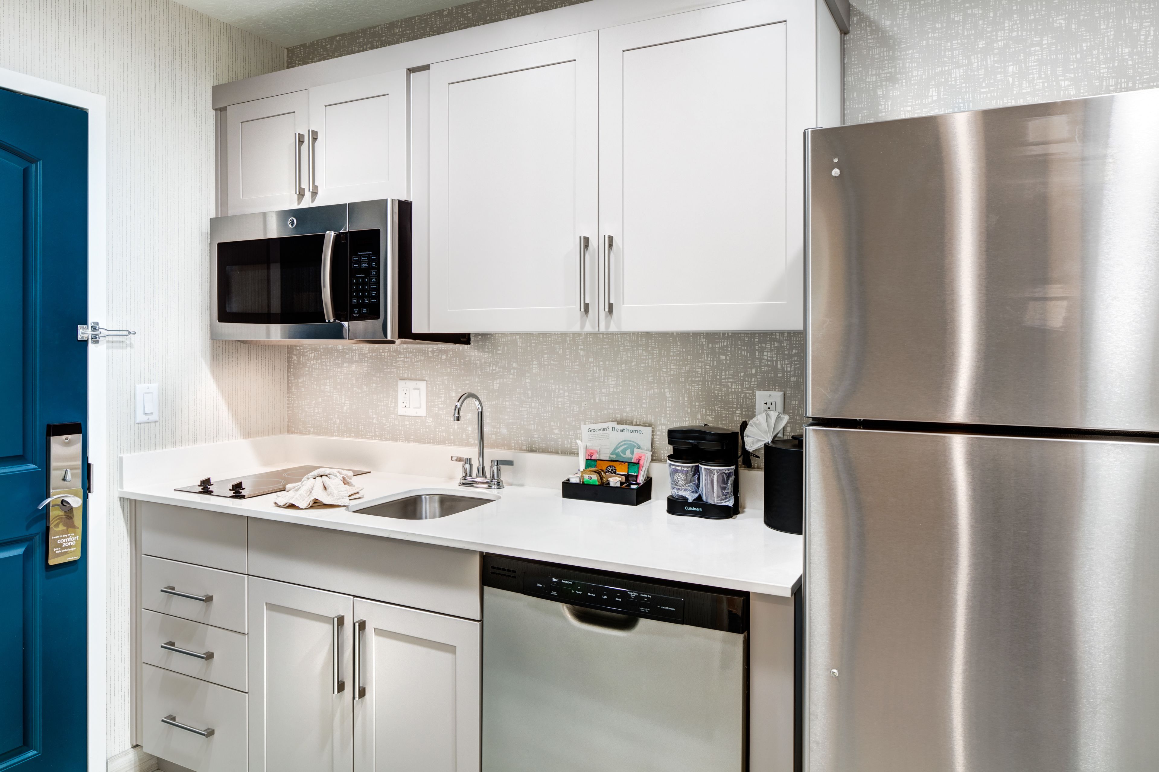 full-sized fridge, microwave, stovetop, dishwasher