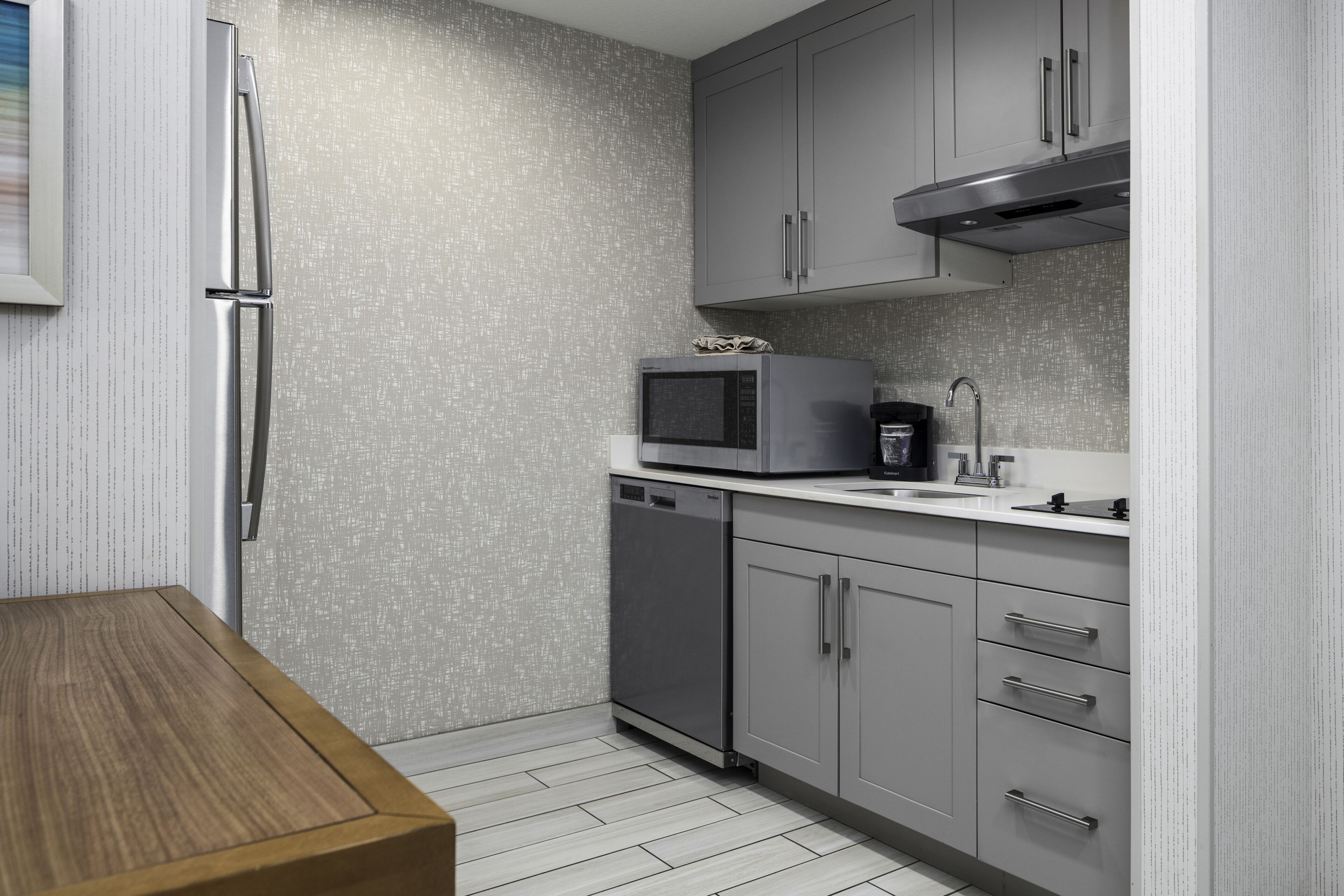 full-sized fridge, microwave, stovetop, dishwasher