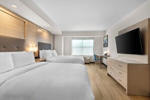 A hotel room with two beds, a desk, a flat-screen TV, and a window. - City Express by Marriott Pooler Savannah Airport (Pooler)