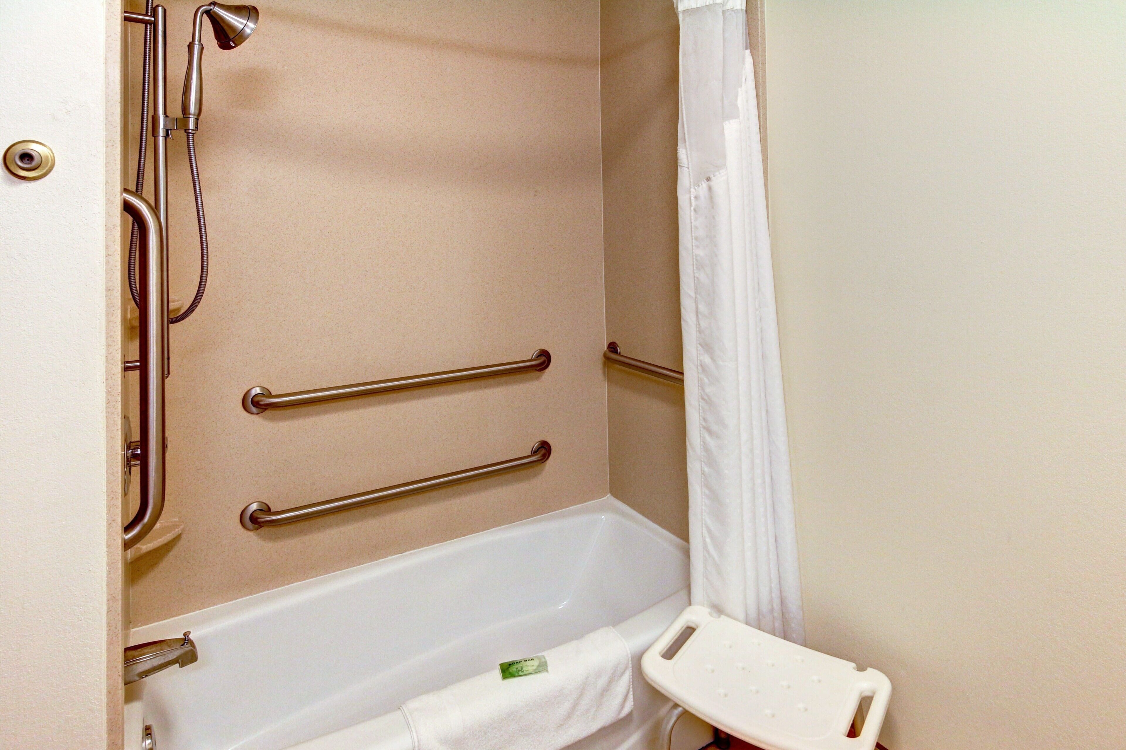 combined shower/bathtub, designer toiletries, hair dryer, towels