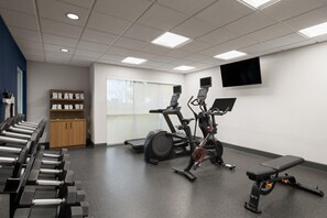 A gym with exercise equipment, a television, and a window. - Hampton Inn & Suites Sacramento-Airport-Natomas (Sacramento)