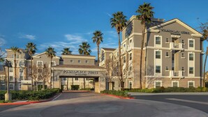 A multi-story hotel with a prominent entrance labeled "Towneplace Suites."