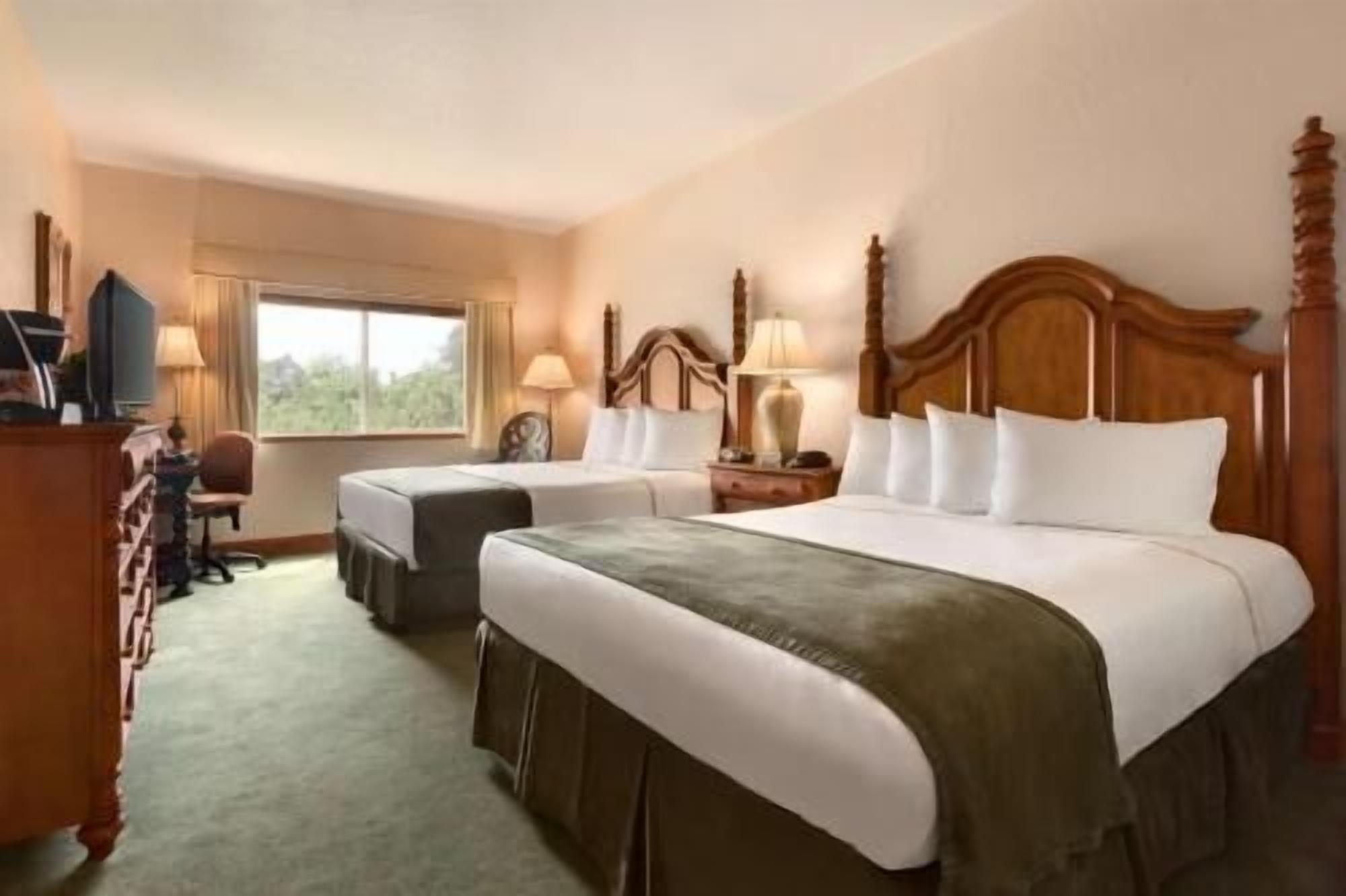 Premium bedding, down duvets, pillow-top beds, in-room safe