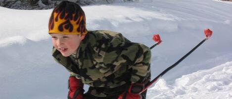 A person skiing in a snowy landscape.