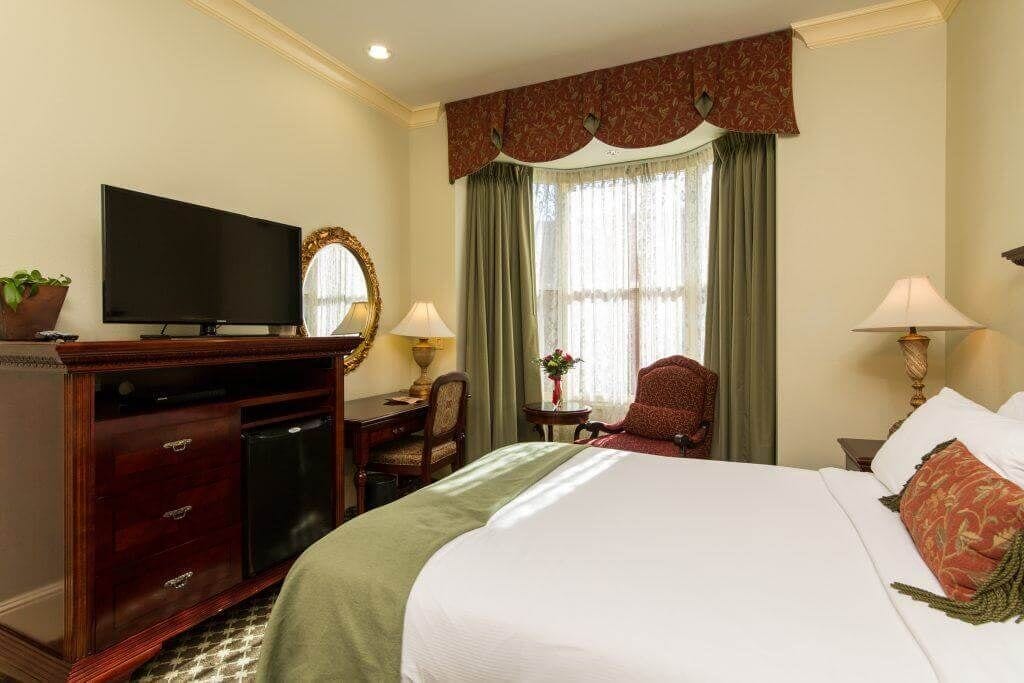 premium room, 1 king bed | premium bedding, in-room safe, desk, blackout curtains