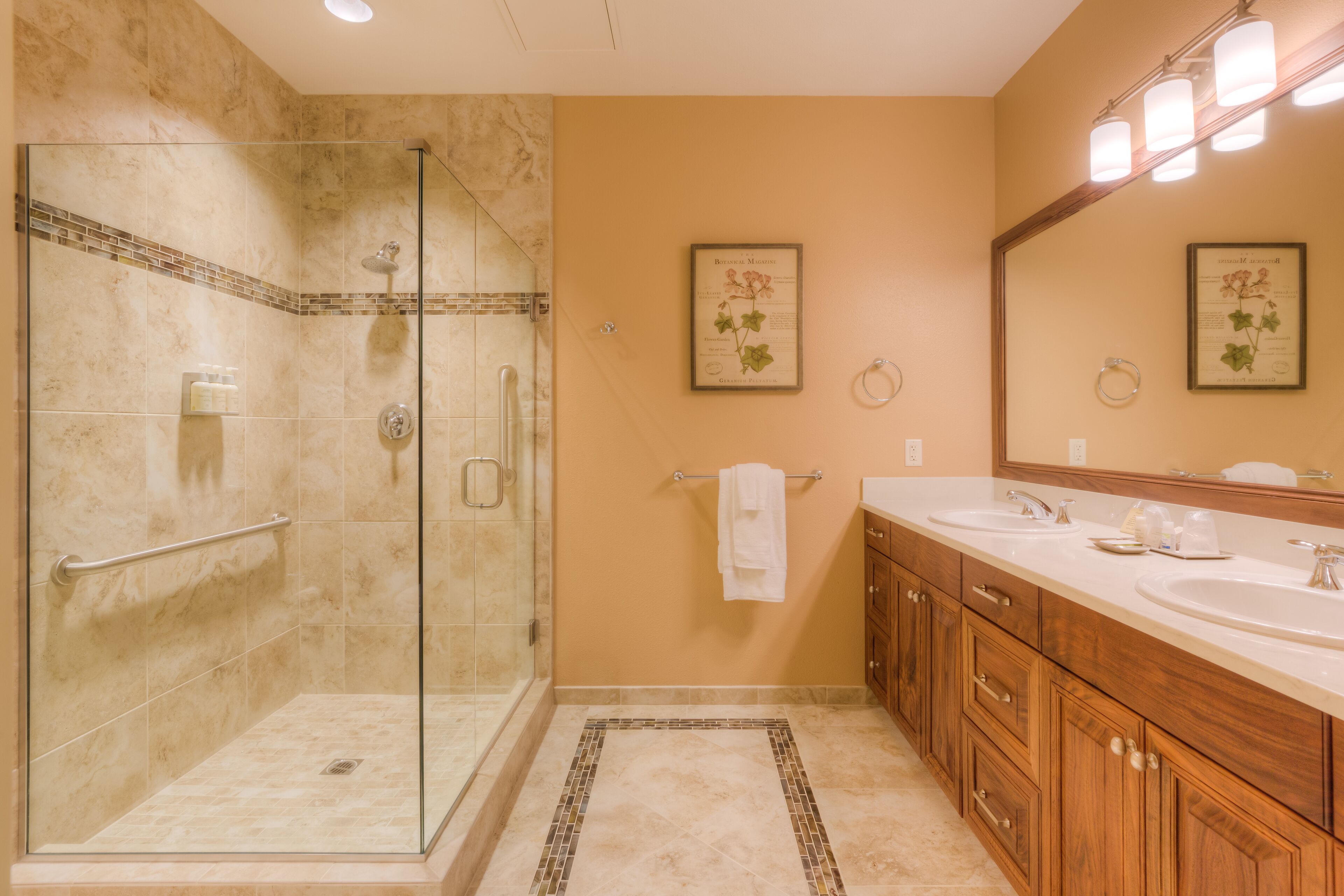 deluxe studio suite | bathroom | free toiletries, hair dryer, bathrobes, slippers