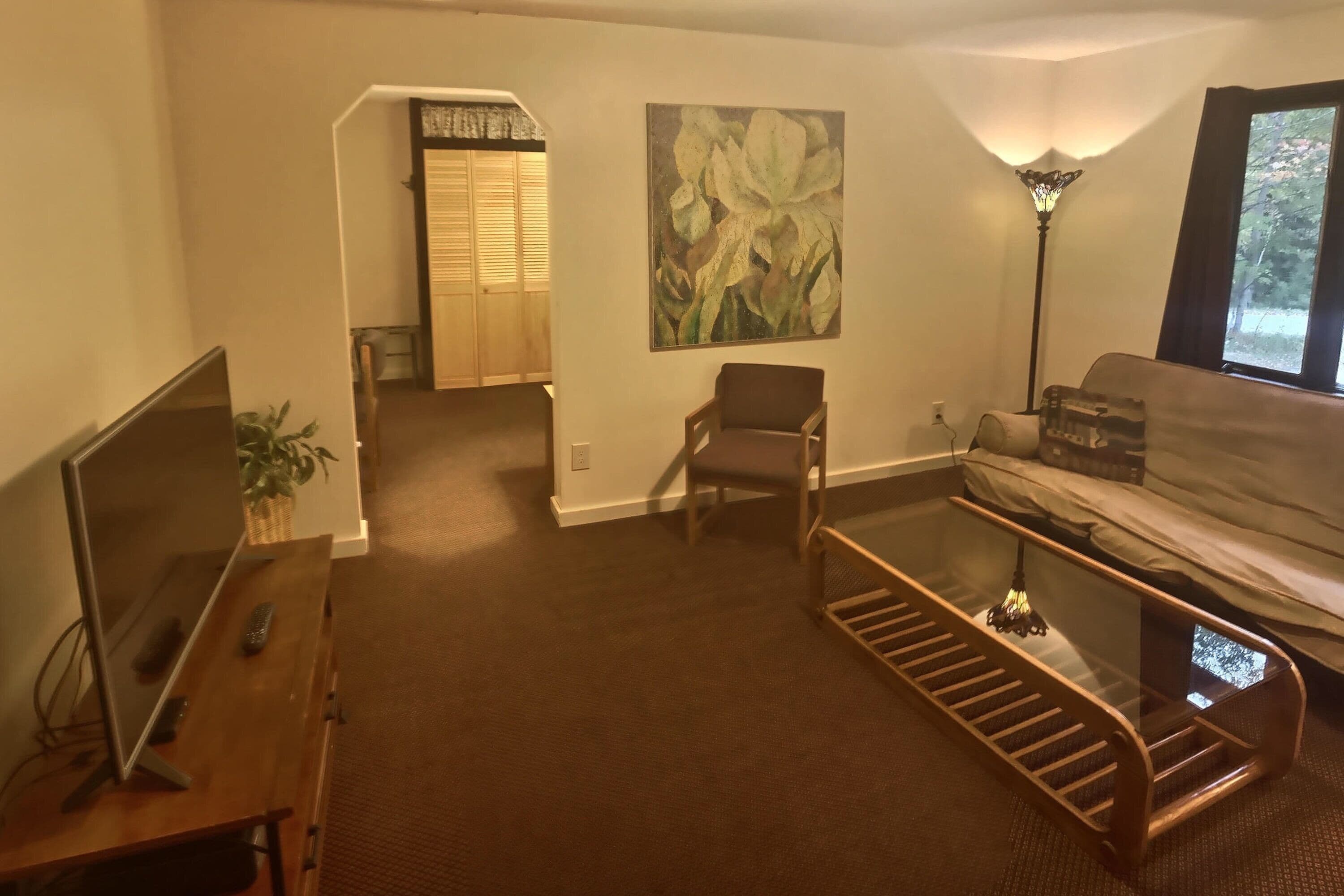 standard suite, multiple bedrooms | living room | 24-inch tv with cable channels