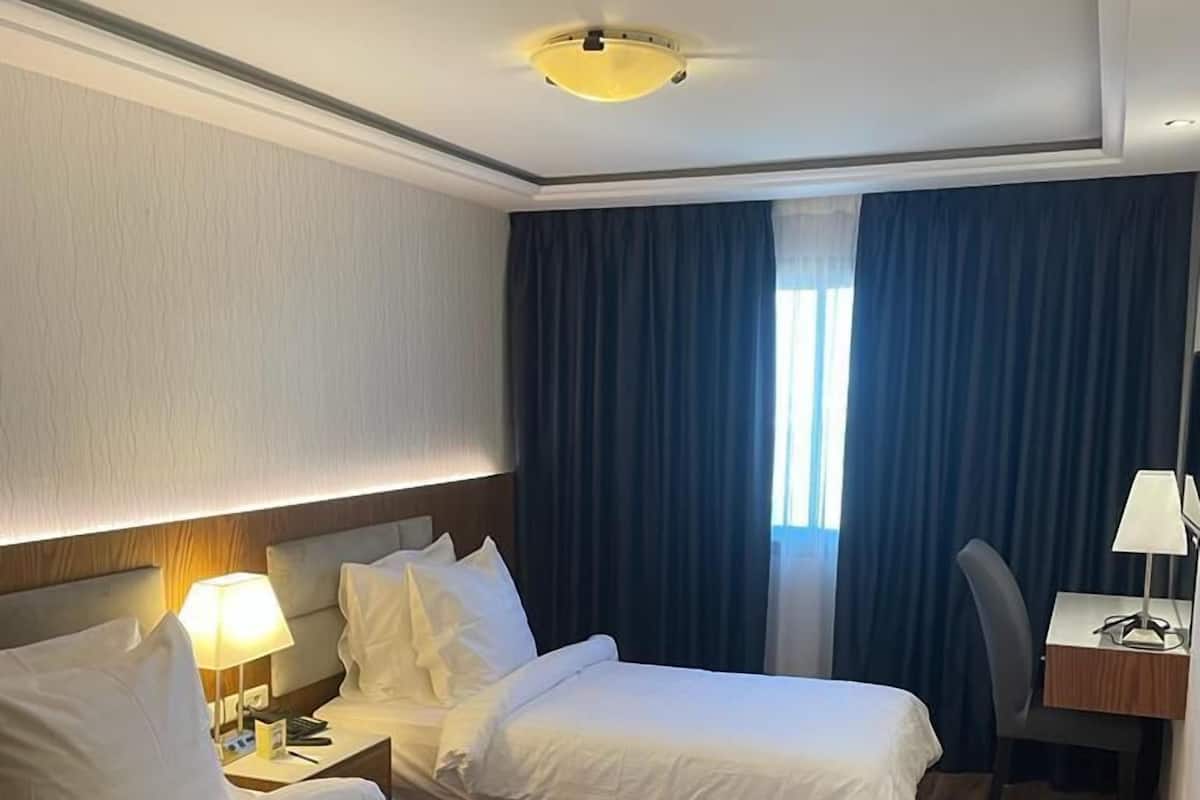 Luxe beddengoed, een minibar, een kluis op de kamer, een laptopwerkplek