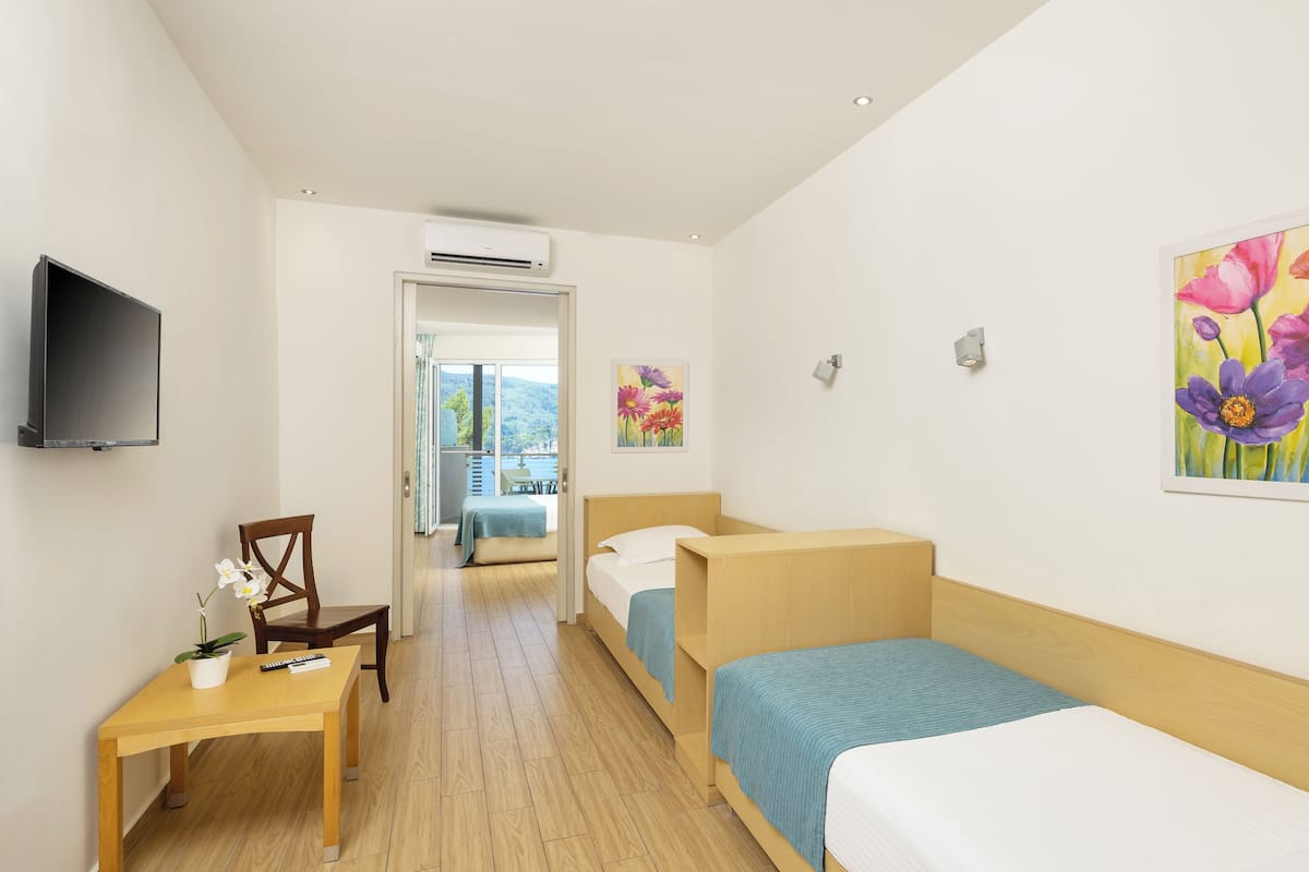 Family Room | 1 bedroom, in-room safe, blackout curtains, free WiFi