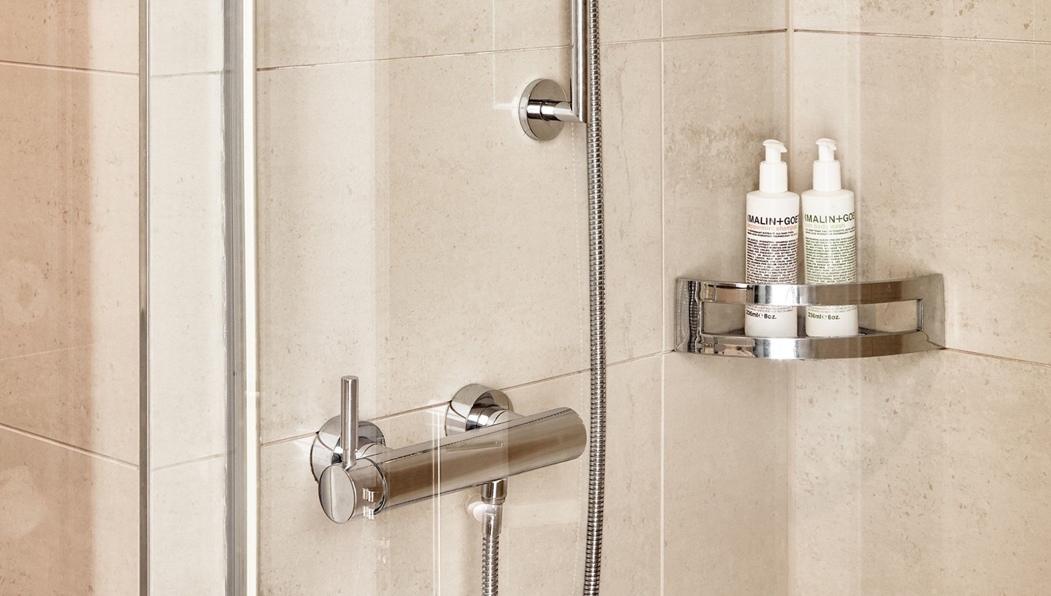 deep-soaking bathtub, designer toiletries, hair dryer, bathrobes