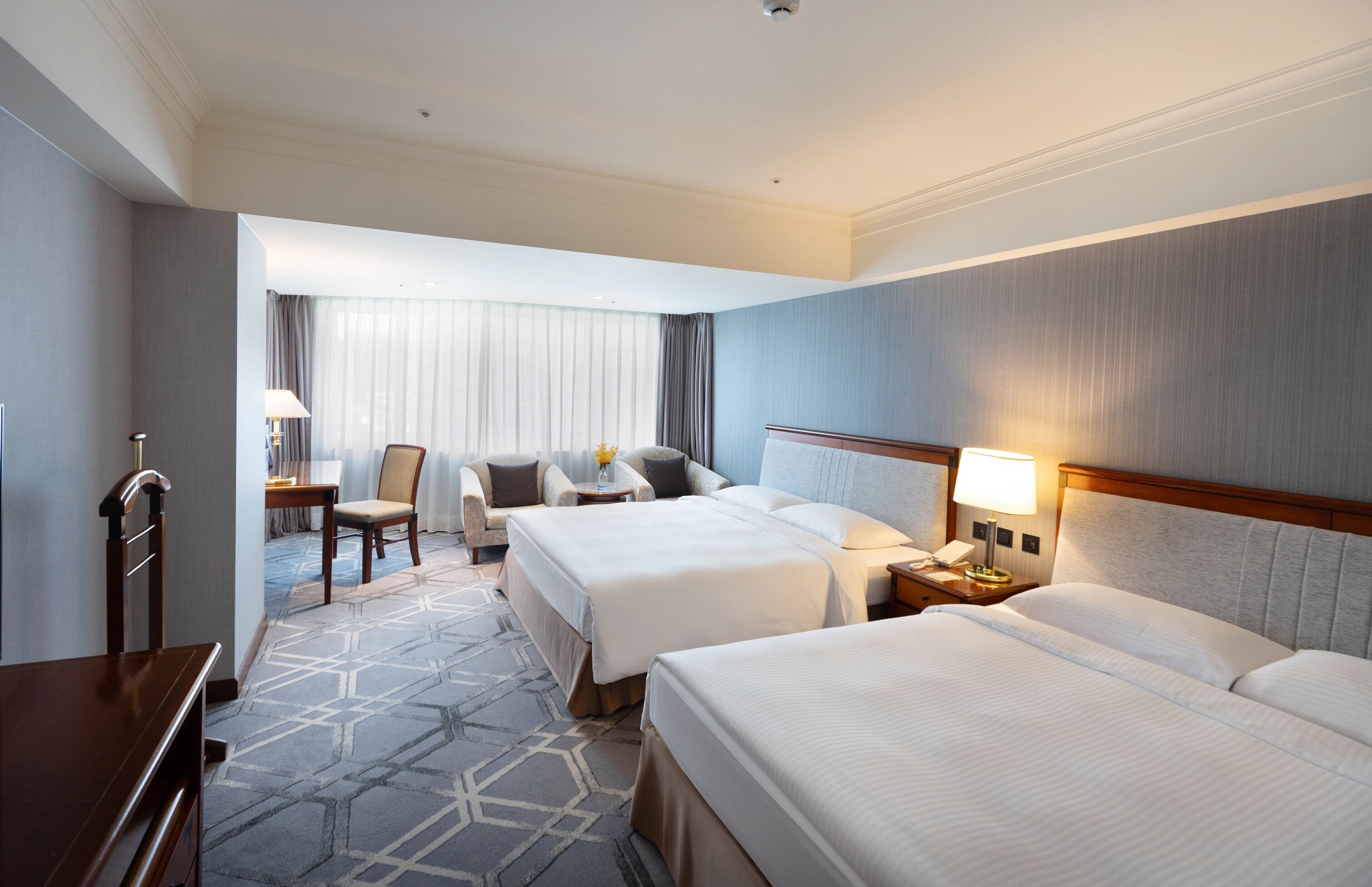 Deluxe Family Room, 2 Queen Beds | Hypo-allergenic bedding, down comforters, minibar, in-room safe