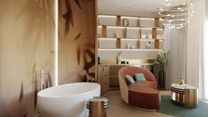 A modern bathroom with a freestanding bathtub, a curved seating area, and a built-in shelving unit with decorative items. - Hotel Val di Sogno (Malcesine)