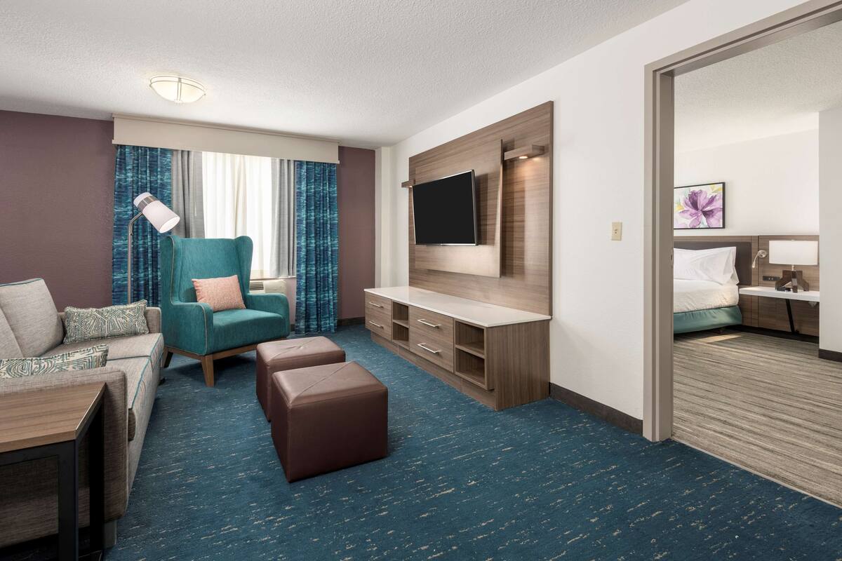 one-bedroom king suite non smoking | living area | 49-inch lcd tv with cable channels, tv, mp3 dock