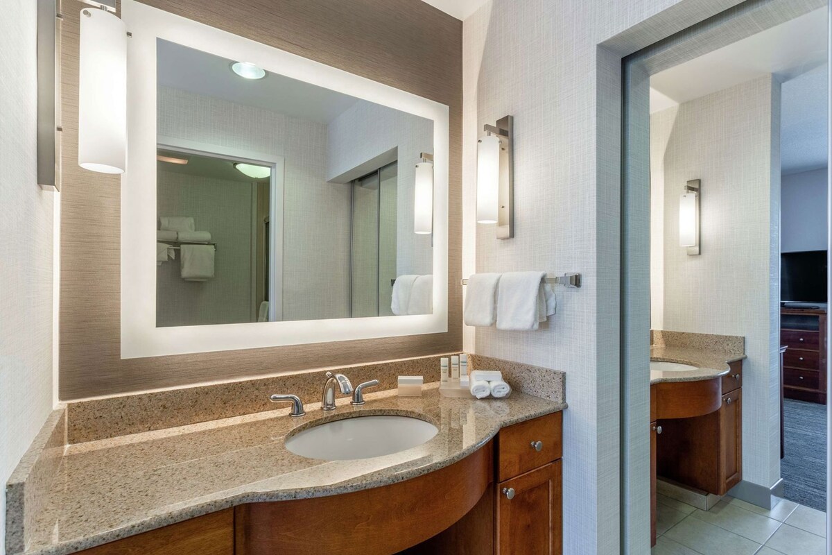 Bathroom | Designer toiletries, hair dryer, towels, soap