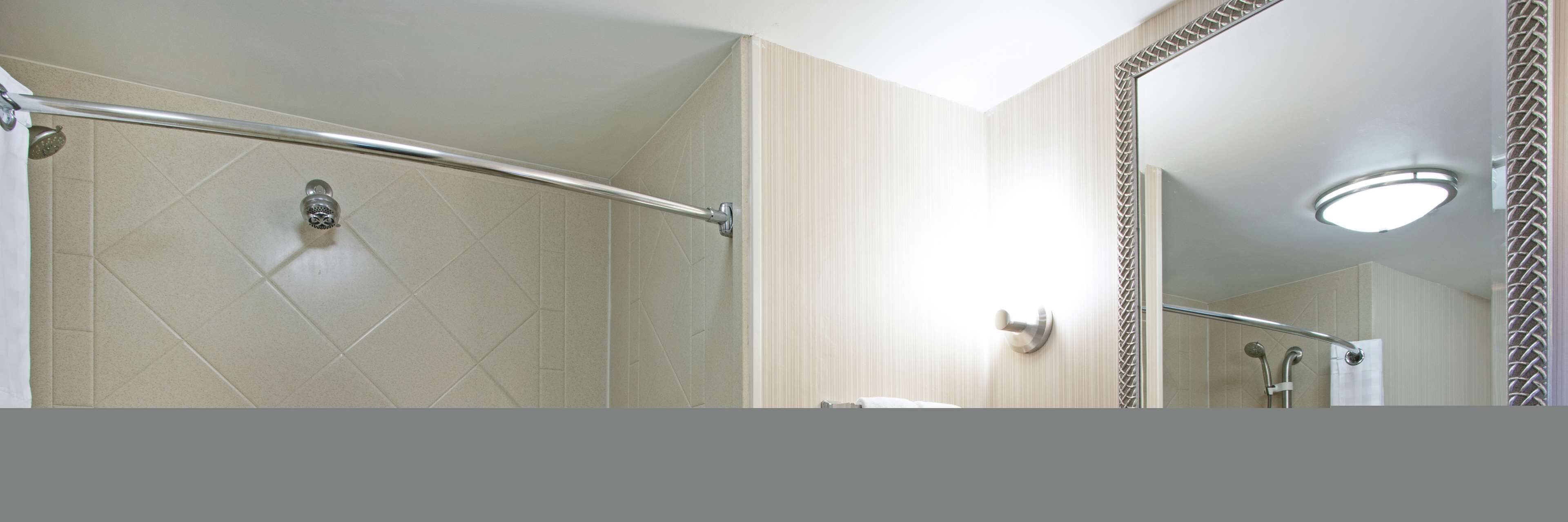 designer toiletries, hair dryer, towels, soap