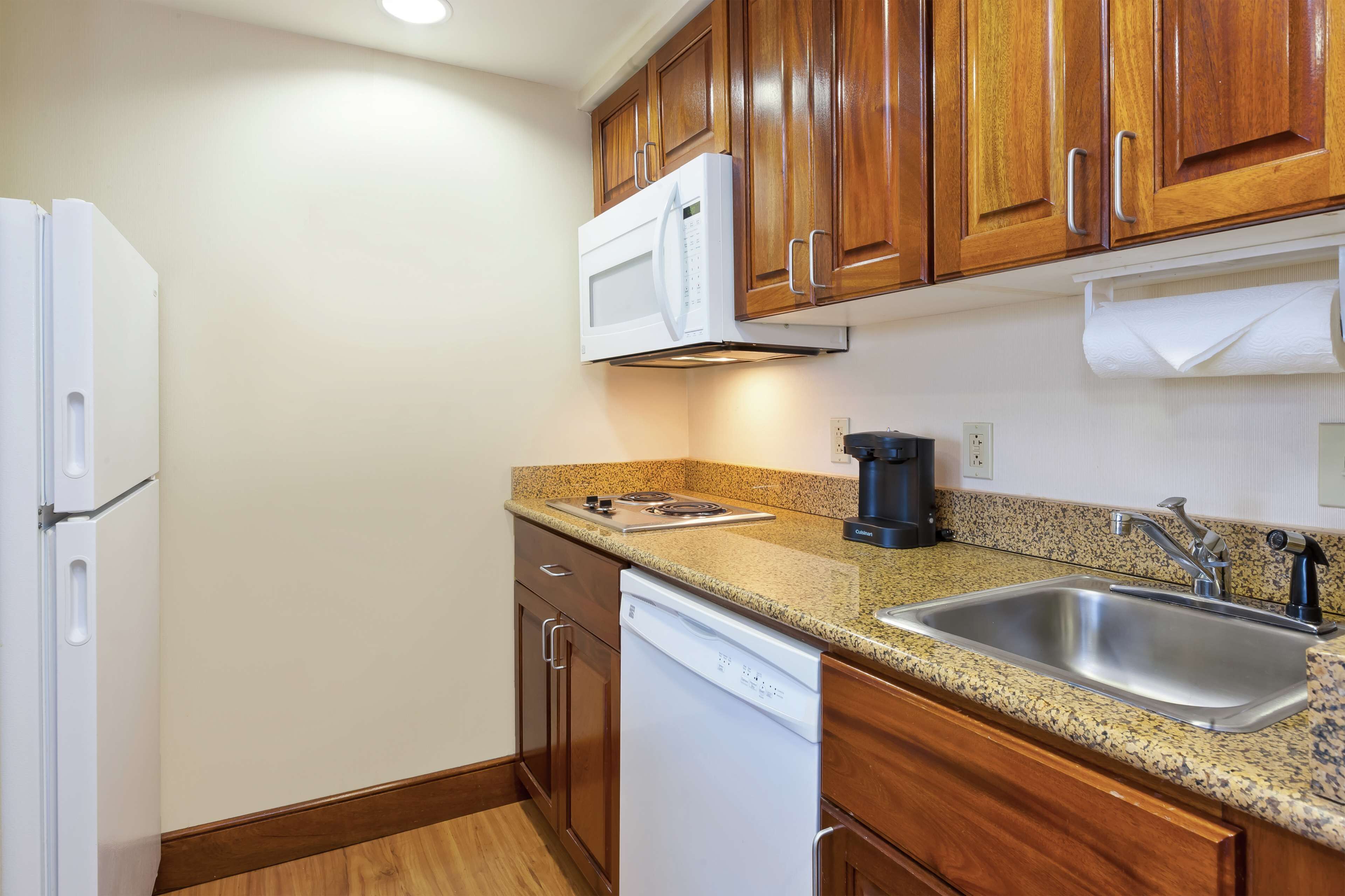 one bedroom suite, two queen beds, non-smoking | private kitchen | full-sized fridge, microwave, stovetop, dishwasher