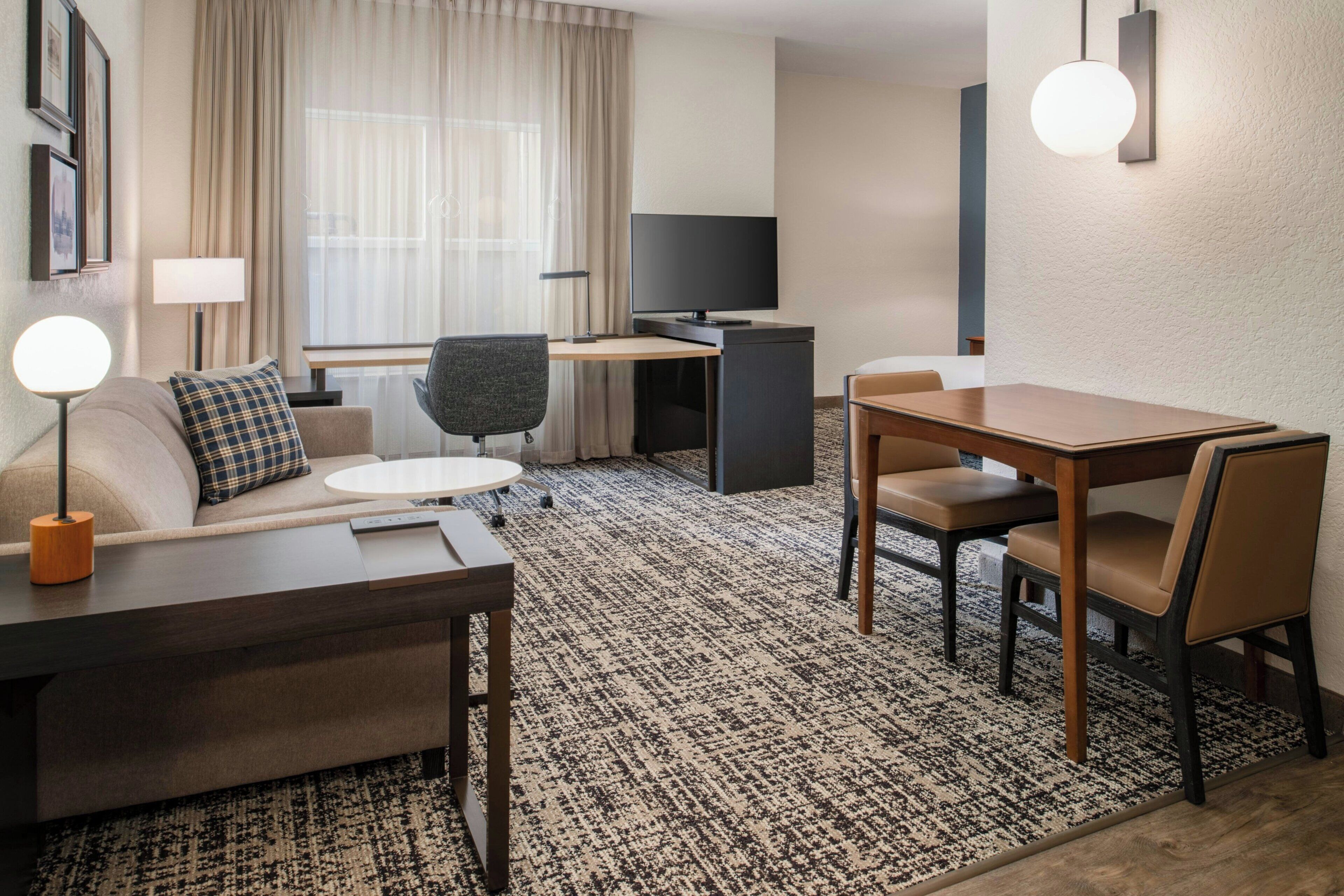Premium bedding, desk, laptop workspace, blackout curtains