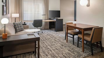Premium bedding, desk, laptop workspace, blackout drapes