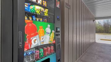 A vending machine with various snacks and drinks, including Gatorade, Tropicana, and Dr. Pepper.