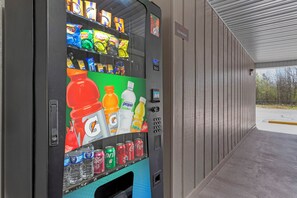 A vending machine with various snacks and drinks, including Gatorade, Tropicana, and Dr. Pepper. - Red Roof Inn Hope (Hope)