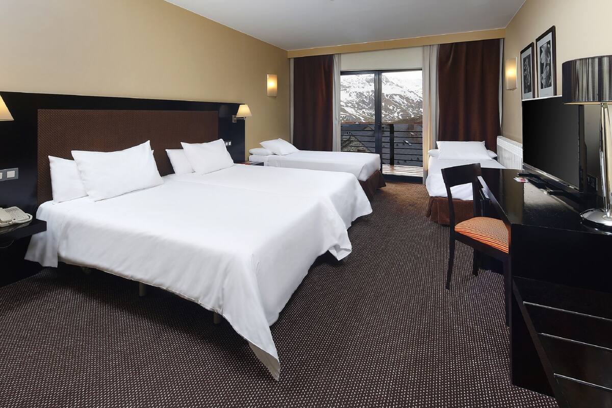 family room | 1 bedroom, minibar, in-room safe, desk