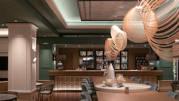 A modern bar area with a long wooden table, multiple chairs, and a unique hanging light fixture.