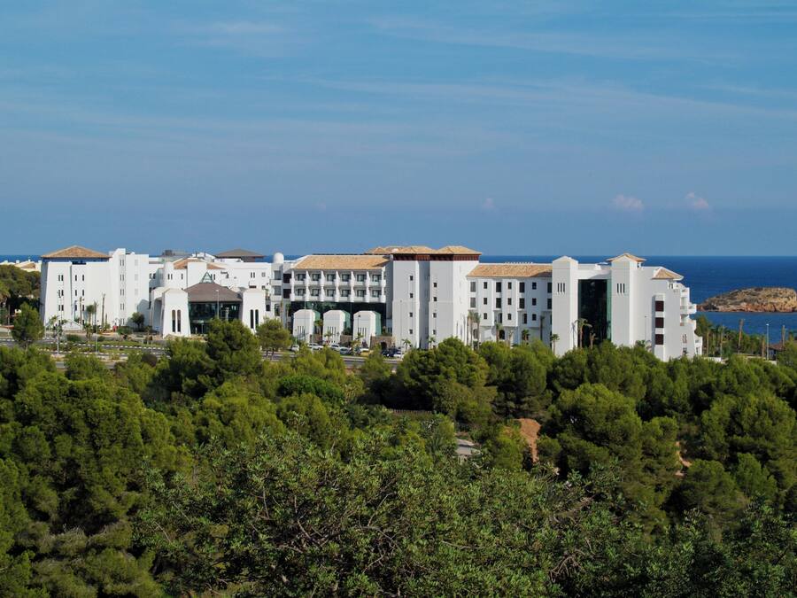 A large, multi-story hotel with a modern architectural style, featuring a prominent entrance and multiple balconies.