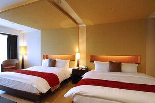 Deluxe Quadruple Room, Bathtub | Down comforters, free minibar, in-room safe, individually decorated