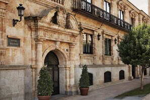 A historic building with a sign reading "HOTEL RECTOR."