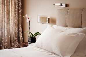 Premium bedding, down duvets, minibar, in-room safe
