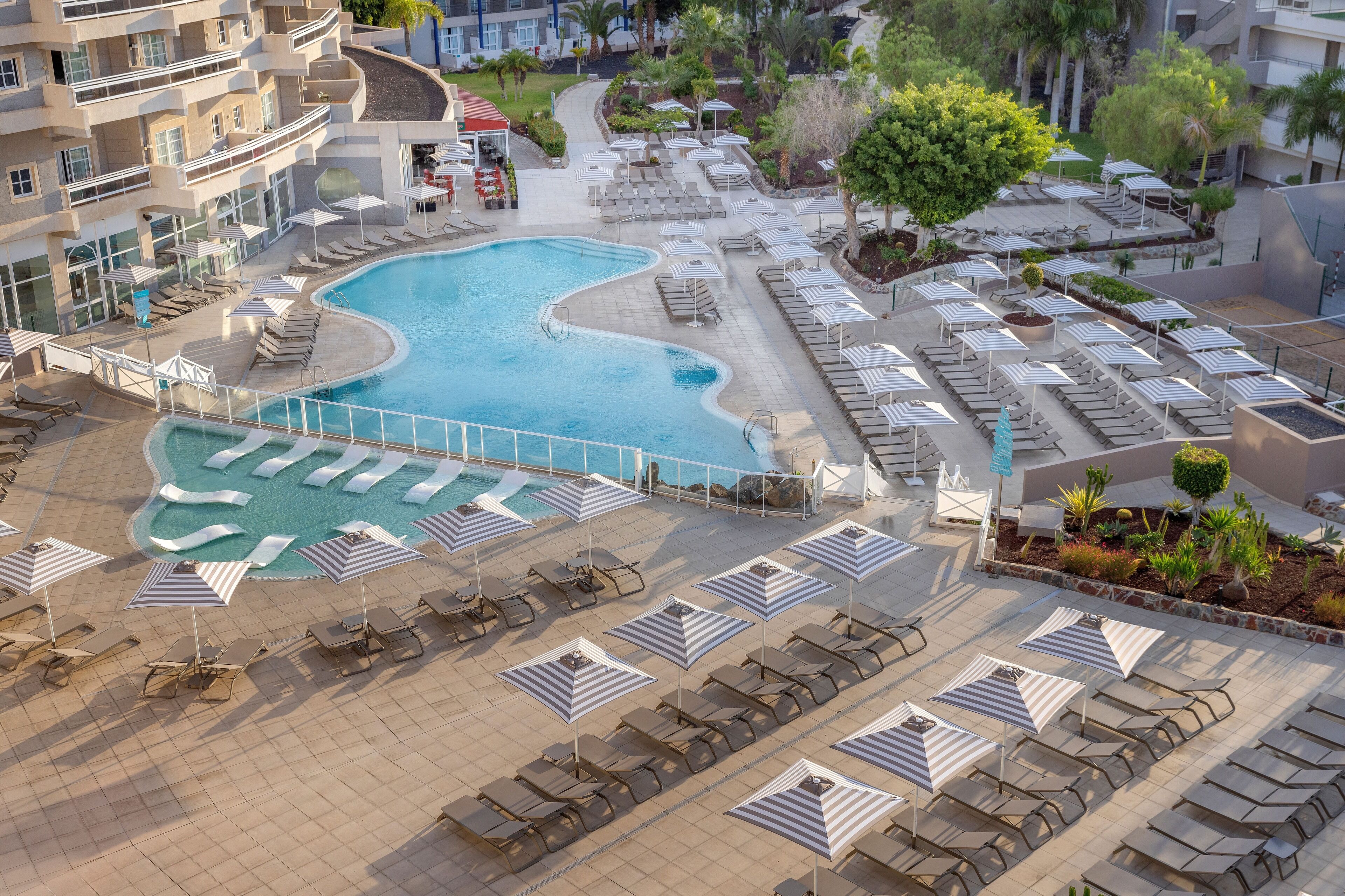 Indoor pool, 4 outdoor pools, open 10:00 AM to 6:00 PM, pool umbrellas